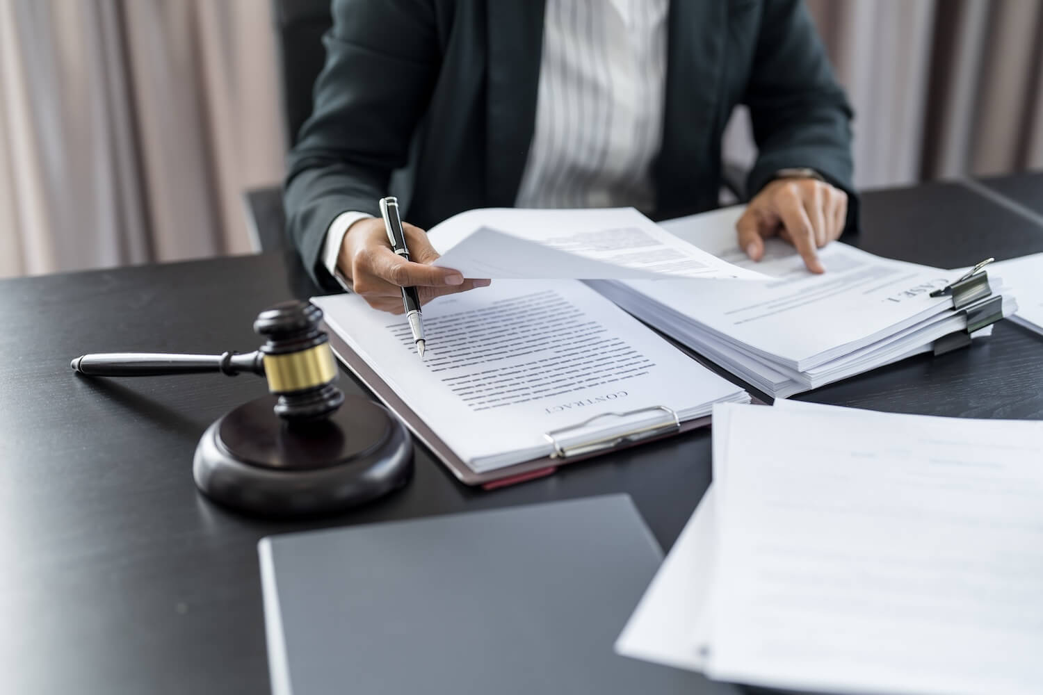 Businessman lawyer working with law book