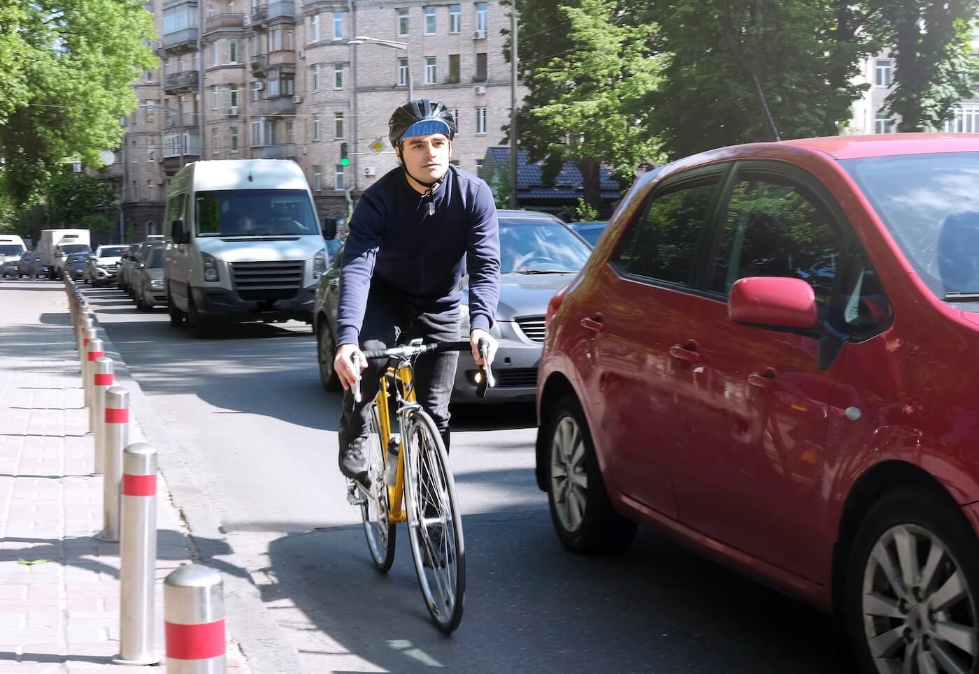 Cyclist on a yellow bike rides