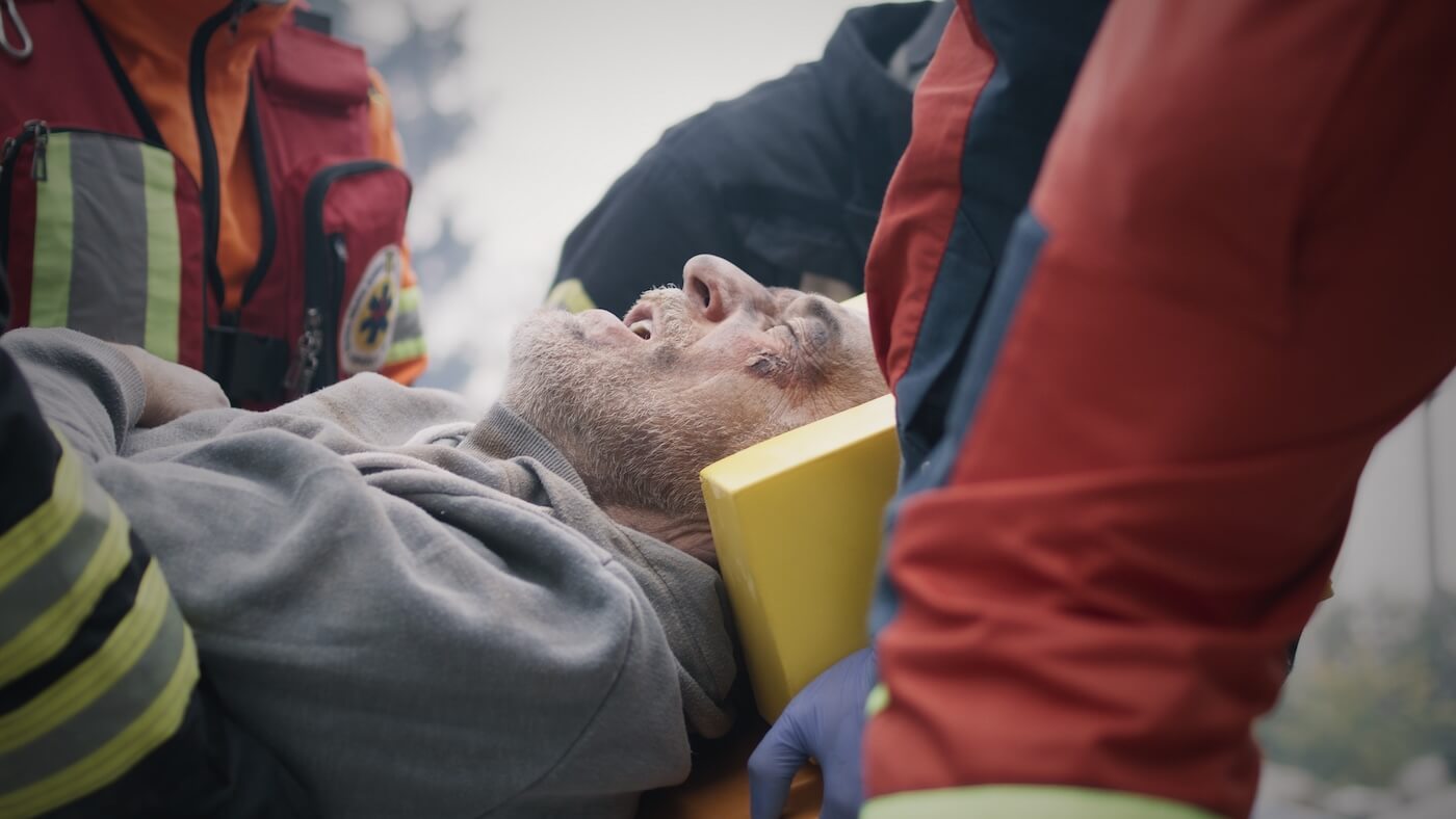 Paramedics carrying an injured man