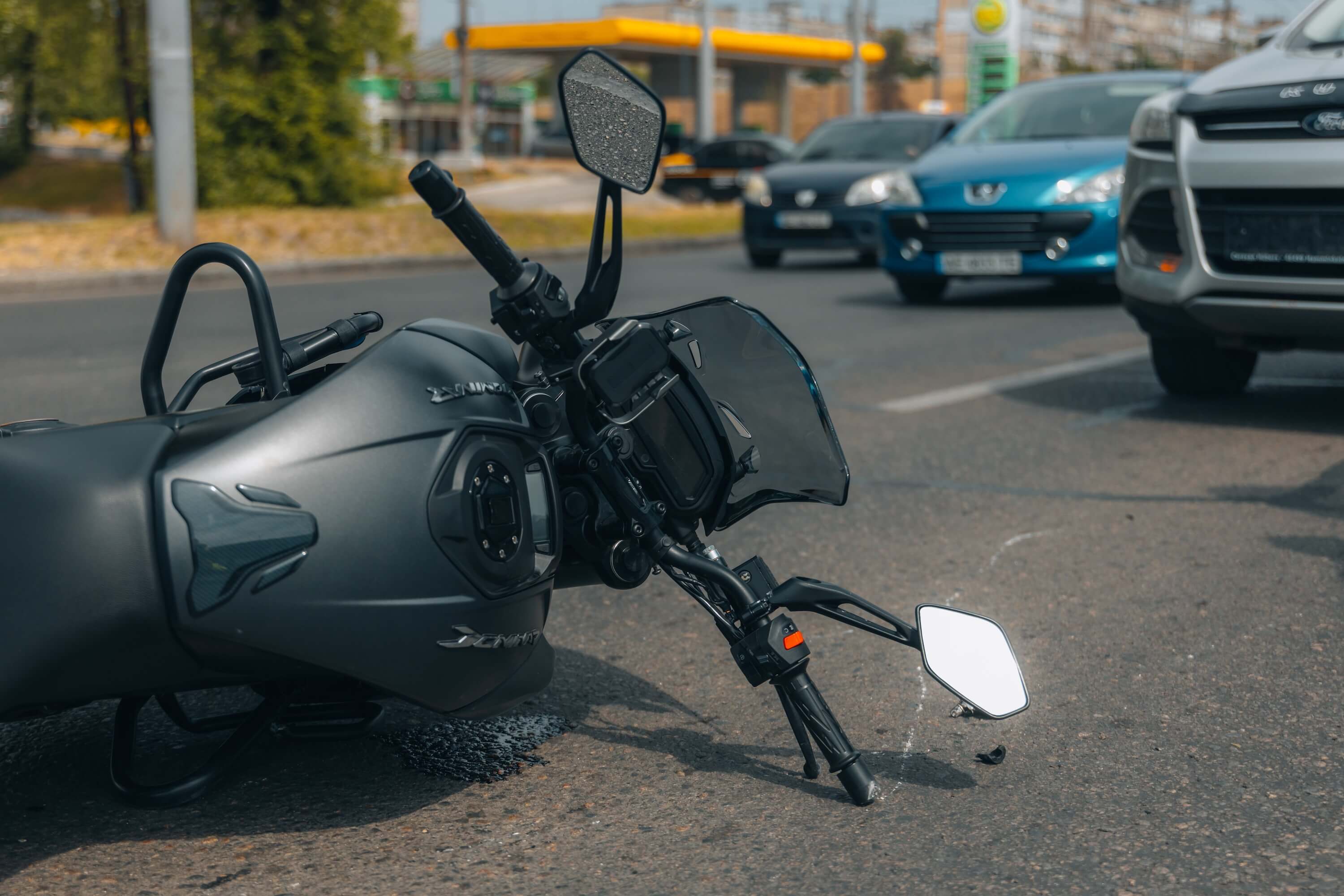 Motorcycle is on the sidewalk